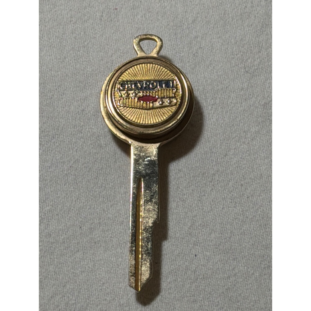 Vintage Chevrolet Gold Tone Enamel Bowtie Logo Uncut Key Blank Type A GM Retro